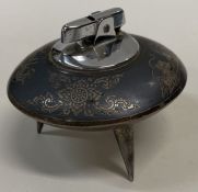 A heavy Thai silver table lighter engraved with boats.