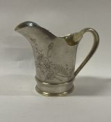 A 19th Century Russian silver engraved jug. Marked underneath