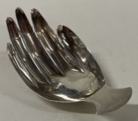 A George III silver caddy spoon with fluted bowl in the form of a hand. London 1806