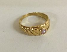 An 18 carat gold single stone ring.