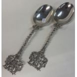 A fine pair of Victorian silver pierced spoons cast with coat of arms to handles. Import marked.