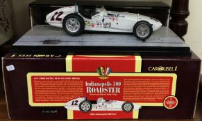 CAROUSEL 1: A 1:18 scale boxed model of an Indianapolis 500 Roadster.