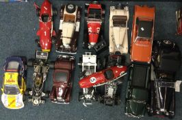 A collection of 1:18 scale unboxed model cars.