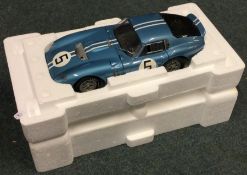 RACE LEGENDS: A Cobra Datona 1:18 scale unboxed model car.