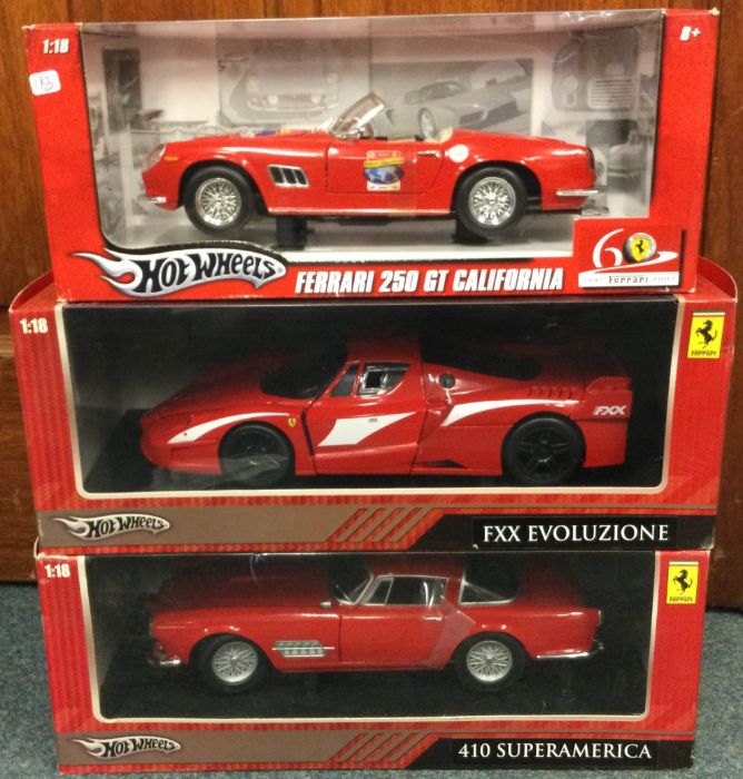 HOT WHEELS: Three 1:18 scale boxed model Ferrari cars.