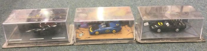 Three boxed Batman model cars.