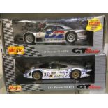 MAISTO: A 1:18 scale boxed model of a Mercedes CLK-GTR together with a boxed model of a Porsche 911.