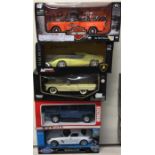 Five various 1:18 scale boxed model cars.