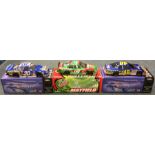 Three various 1:24 scale boxed model race cars.