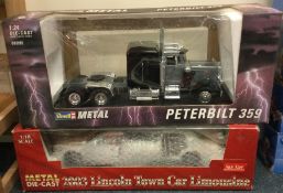 A 1:18 scale die-cast model of a Lincoln Town Car Limousine together with a model of a Peterbilt.