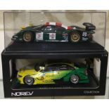 A 1:18 scale boxed model of an Audi A4 together with a 1:18 scale cased model of a Porsche.