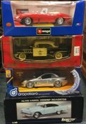 Four boxed 1:18 scale model cars.