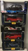 Five various 1:18 scale boxed model cars.