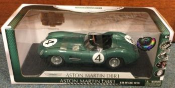 A 1:18 scale boxed die-cast model car of an Aston Martin DBR1.