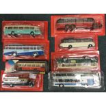 Eight 1:43 scale boxed model buses.