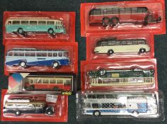 Eight 1:43 scale boxed model buses.