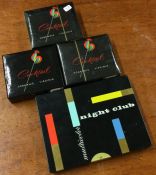 Four packs of cocktail cigarettes.