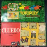 A boxed Cludo game together with The Great Race game.