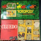 A boxed Cludo game together with The Great Race game.