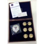 A group of six "The Queen's Jubilee" Proof coins together with a small gold example.