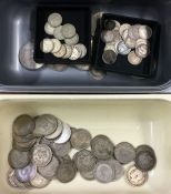 A collection of shillings and other coinage.