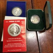 A Cayman Islands silver twenty five dollar coin etc.
