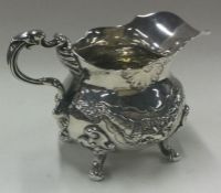A fine Victorian silver jug embossed with vines. London 1839.