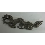 A large Chinese silver brooch in the form of a dragon. Approx. 42 grams.