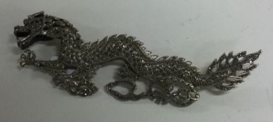 A large Chinese silver brooch in the form of a dragon. Approx. 42 grams.