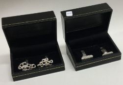 Two pairs of modern silver cufflinks.