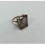 A 9 carat large single stone ring. Approx. 9 grams.