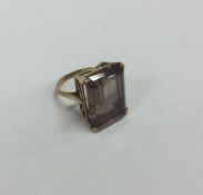A 9 carat large single stone ring. Approx. 9 grams.
