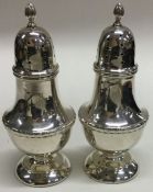 A pair of Edwardian silver sugar casters. Birmingham. Approx. 95 grams.