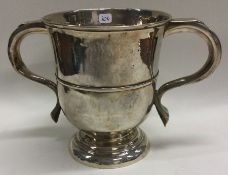 An early George I two handled silver cup. London circa 1720. By Edward Pocock.