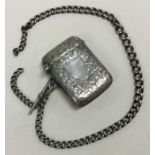 An engraved silver vesta on suspension chain. Birmingham 1912. By JC Ltd.
