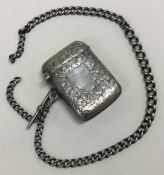 An engraved silver vesta on suspension chain. Birmingham 1912. By JC Ltd.
