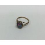 A small 9 carat opal mounted ring. Approx. 2 grams