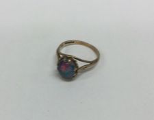 A small 9 carat opal mounted ring. Approx. 2 grams