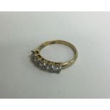 A small diamond mounted five stone ring in gold setting. Approx. 3 grams