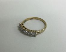 A small diamond mounted five stone ring in gold setting. Approx. 3 grams