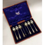 A good boxed set of six silver teaspoons together with matching tongs. Sheffield.