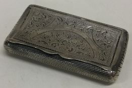 An early shaped silver snuff box with hinged decoration.