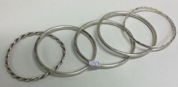 A group of five heavy silver bangles. Approx. 104 grams.