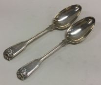 A heavy pair of fiddle and thread pattern silver dessert spoons.