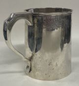 A large Victorian silver engraved presentation pint mug.
