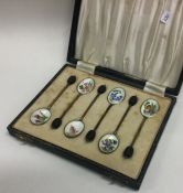 A cased set of six silver and enamelled teaspoons. Birmingham.