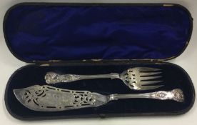 A cased pair of silver servers engraved with swans. London 1872.