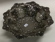 A chased silver sweet dish. Birmingham. Approx. 97 grams.