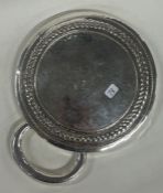 AMY SANDHEIM: A silver textured mirror. London 1926. Est. £300 - £500.