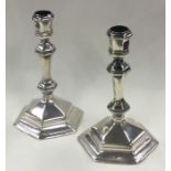 A fine and unusual pair of George I silver octagonal candlesticks. London 1718.